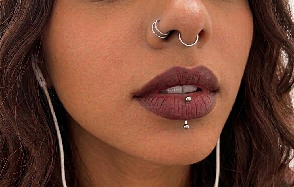 Septum and vertical labret piercings